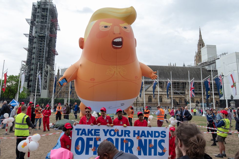 A blimp of Donald Trump paraded during protests