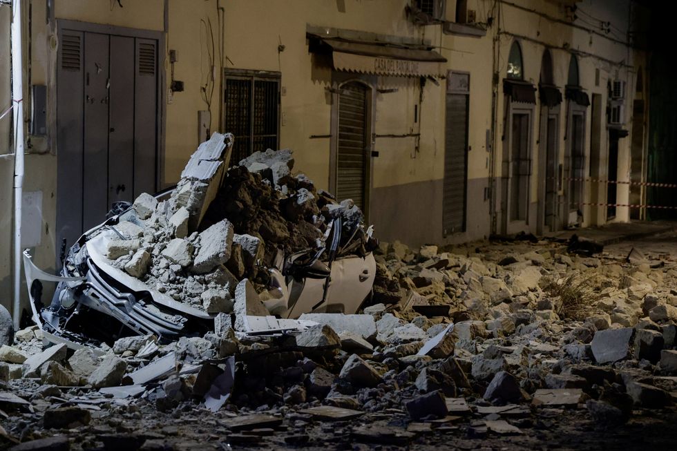 A car crushed by rubble after a magnitude 4.7 earthquake struck Campi Flegrei