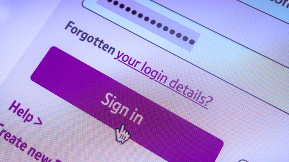 a computer mouse hovers over the sign in button of a password login field on a website 