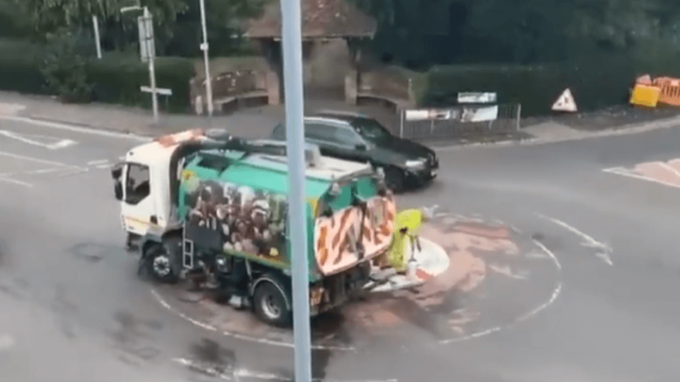 A council worker removing the paint