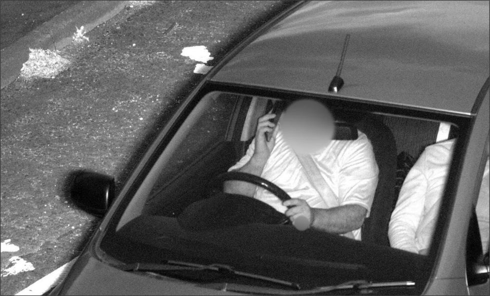 A driver caught by AI speed camera using his phone at the wheel 