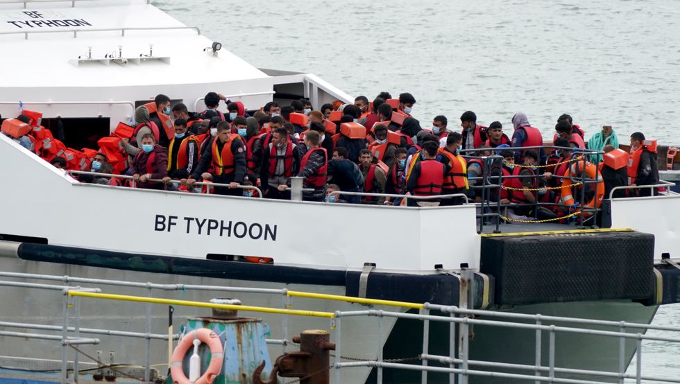 A group of people thought to be migrants are brought in to Ramsgate, Kent