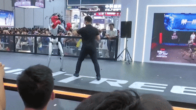 A man has been filmed going toe-to-toe with a humanoid robot in an extraordinary sparring session as China showcased the latest advances in its rapidly expanding robotics industry
