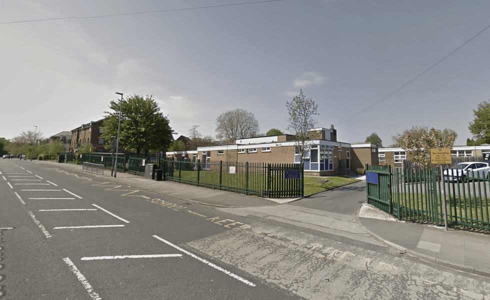 A Manchester school was forced into a lockdown; GMP police car