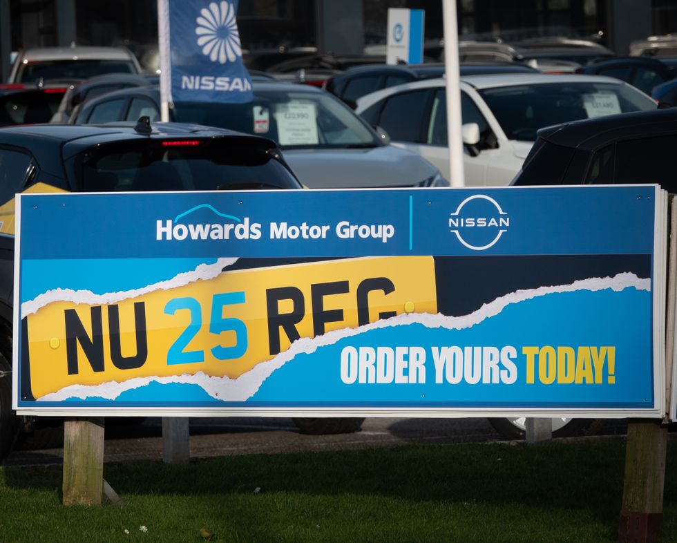 A new number plate advert outside a car dealership