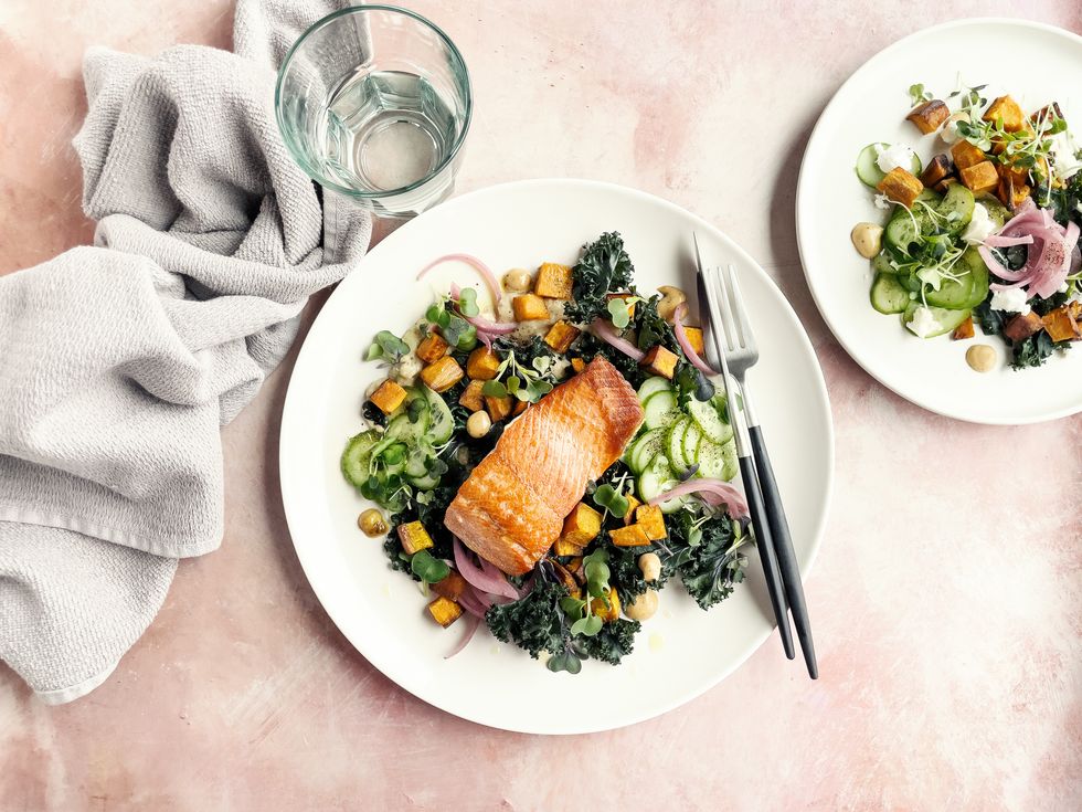 A plate of salmon and salad
