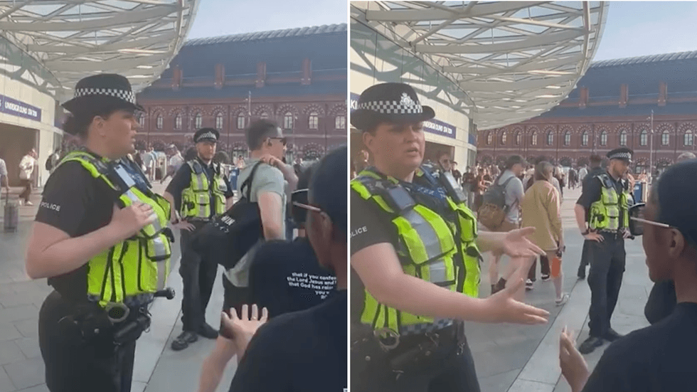 A police officer attempts to shut down a group of preachers