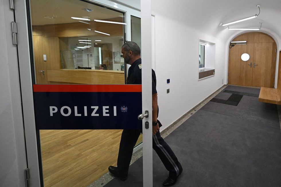 A police officer opens a door inside Adolf Hitler's former home