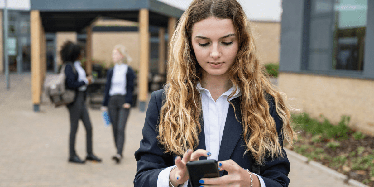 Mobile phones will be BANNED by law in England's schools to 'put children’s interests first'
