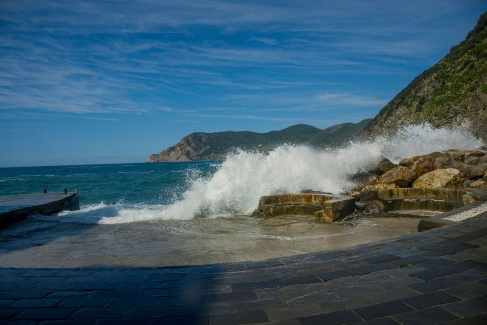 A wave breaking against a wall in Vernazza