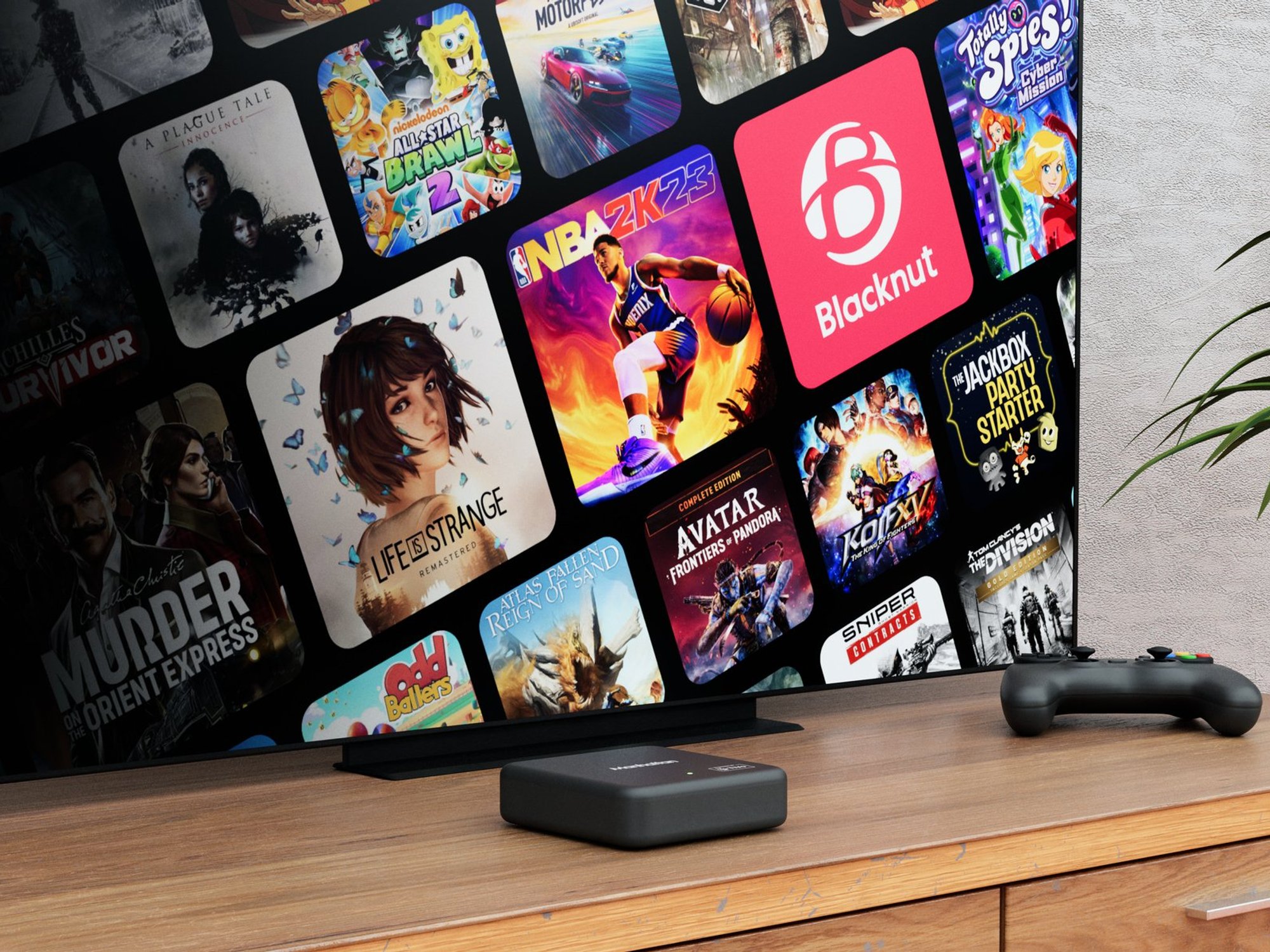 Aero TV box with game controller in front of TV