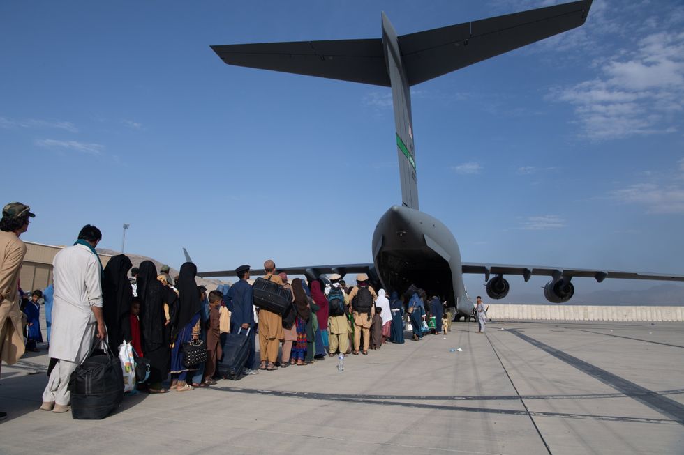 Afghans boarding plane 2021