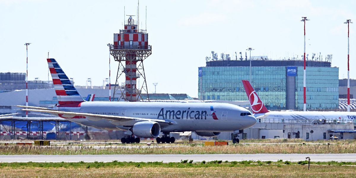 Flight chaos as out-of-control passenger BITES fellow flyer sparking panicked message from pilot