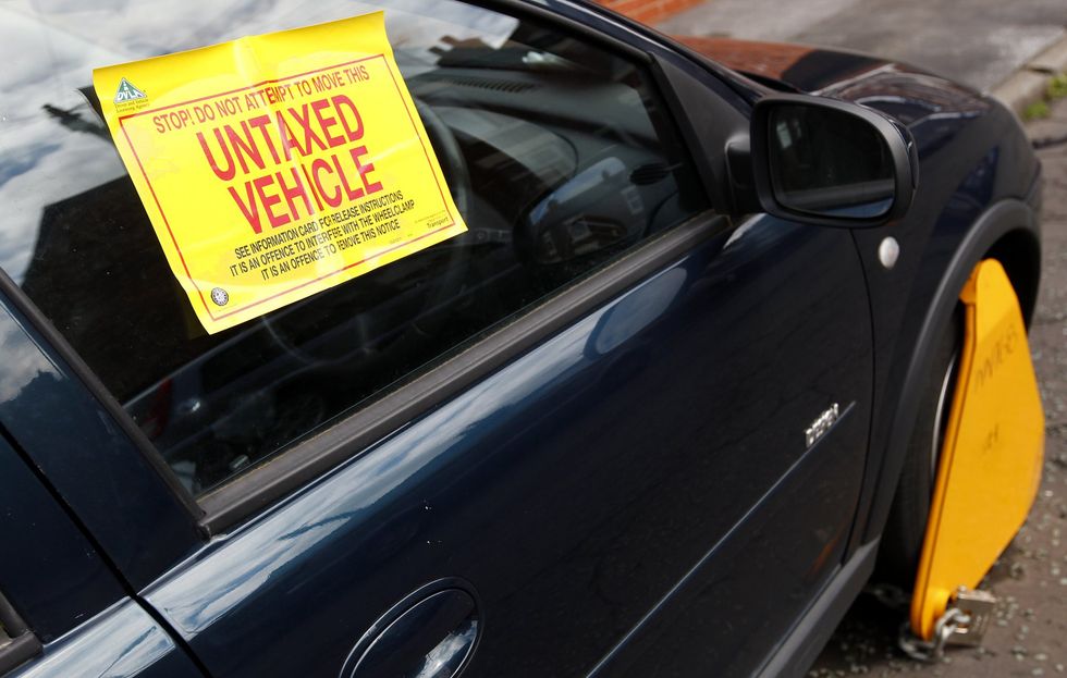 An untaxed vehicle with a DVLA wheel clamp