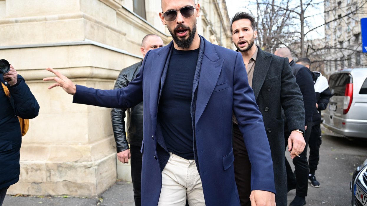 Andrew Tate (L) and Tristan Tate (R) walk from the Bucharest's Court of Appeal