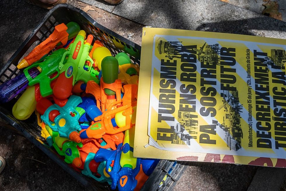 Anti-tourism sign and water pistols
