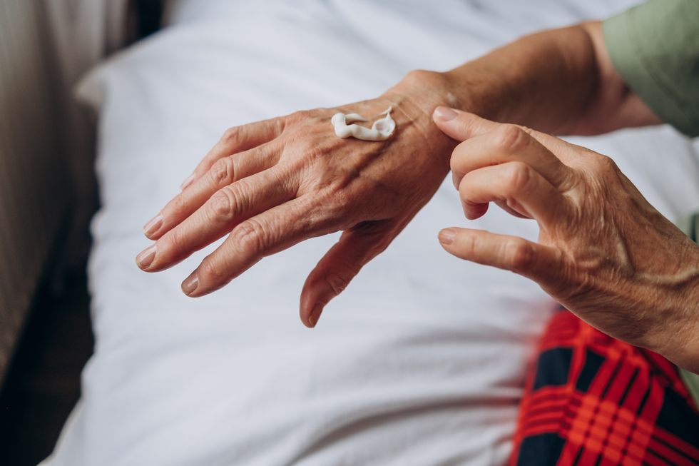 applying cream to hands