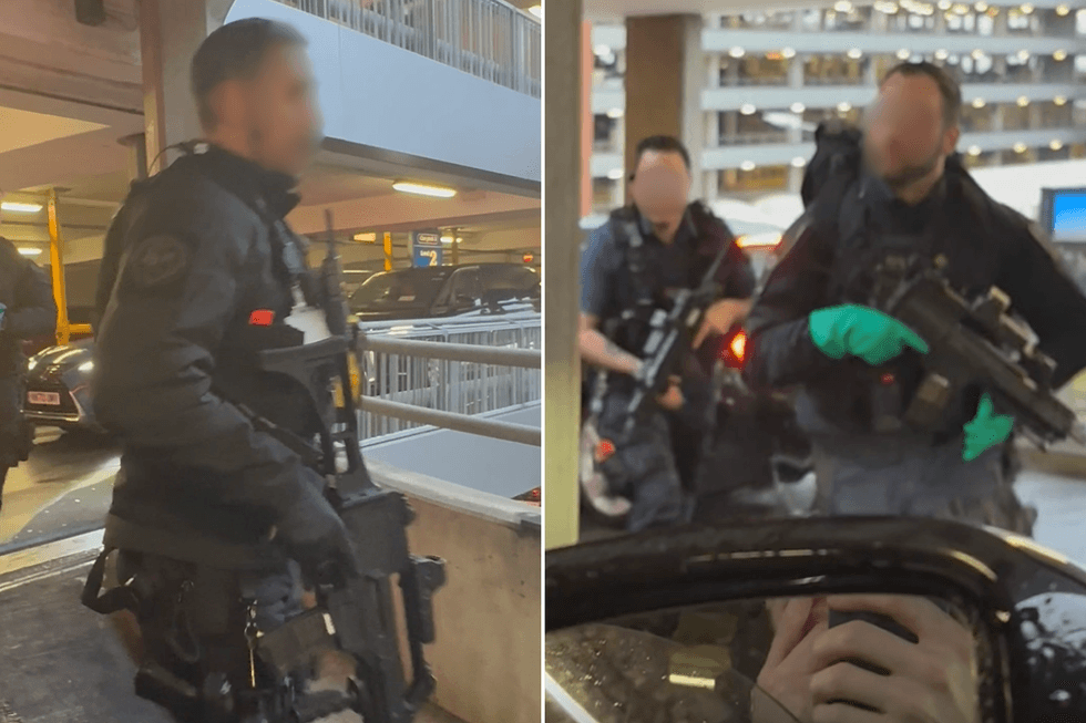 Armed police storming Heathrow car park