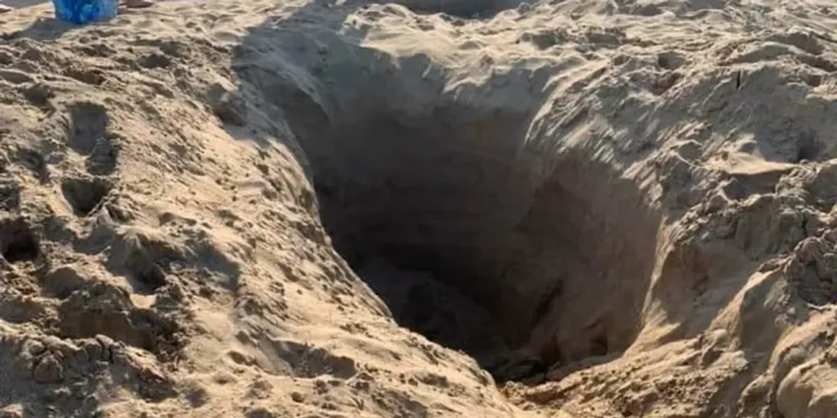 Britons ordered to stop digging big holes at the beach over 'risk of death' during summer holidays