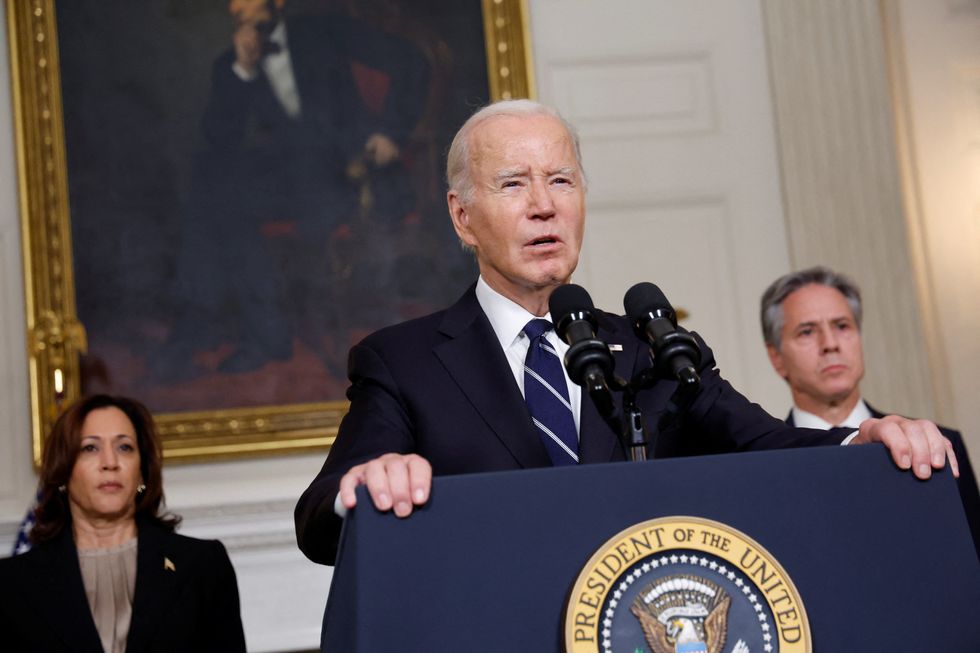 Biden speaking, with Harris and Anthony Blinken behind him