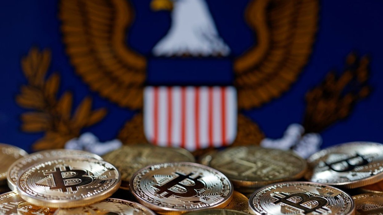 Bitcoin coins and SEC logo