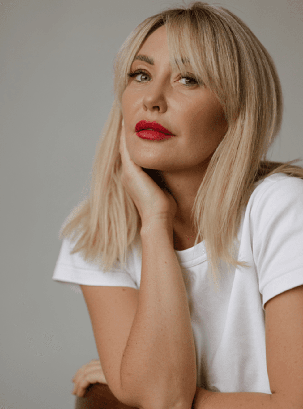 Blonde woman looking at camera