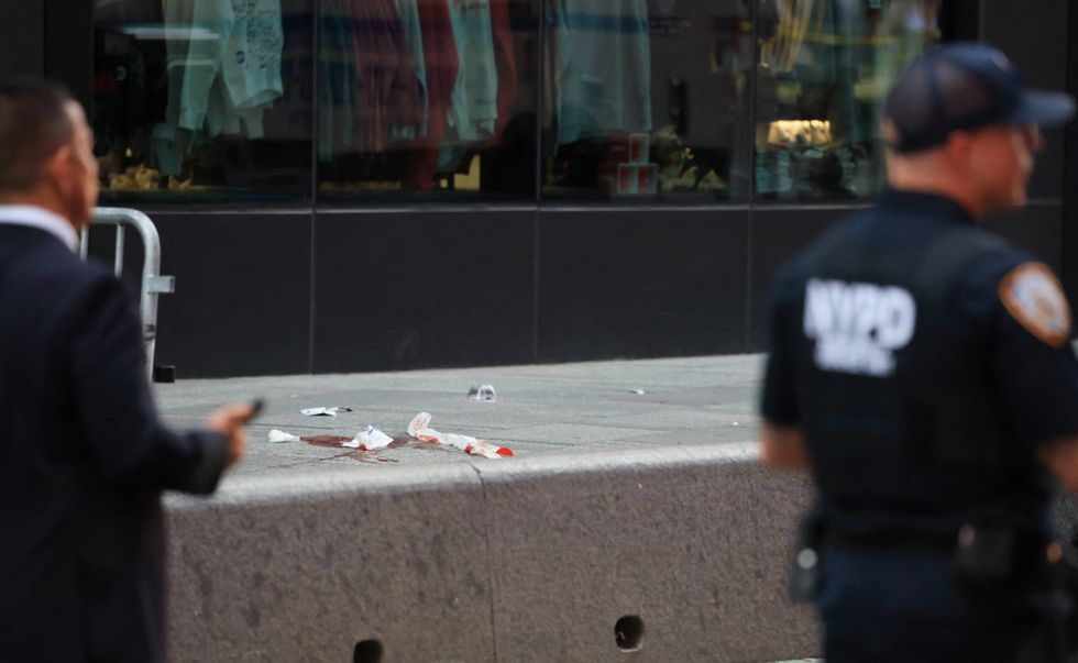 Blood seen on the streets of New York's Times Square after the horrifying stabbing
