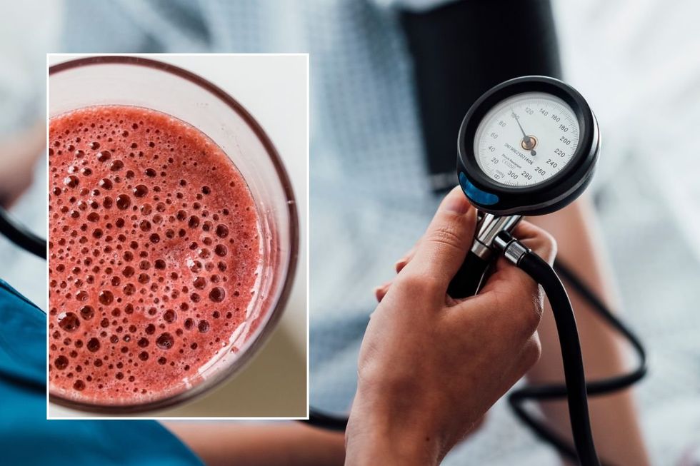 BLOOD SUGAR MONITOR AND GLASS OF JUICE