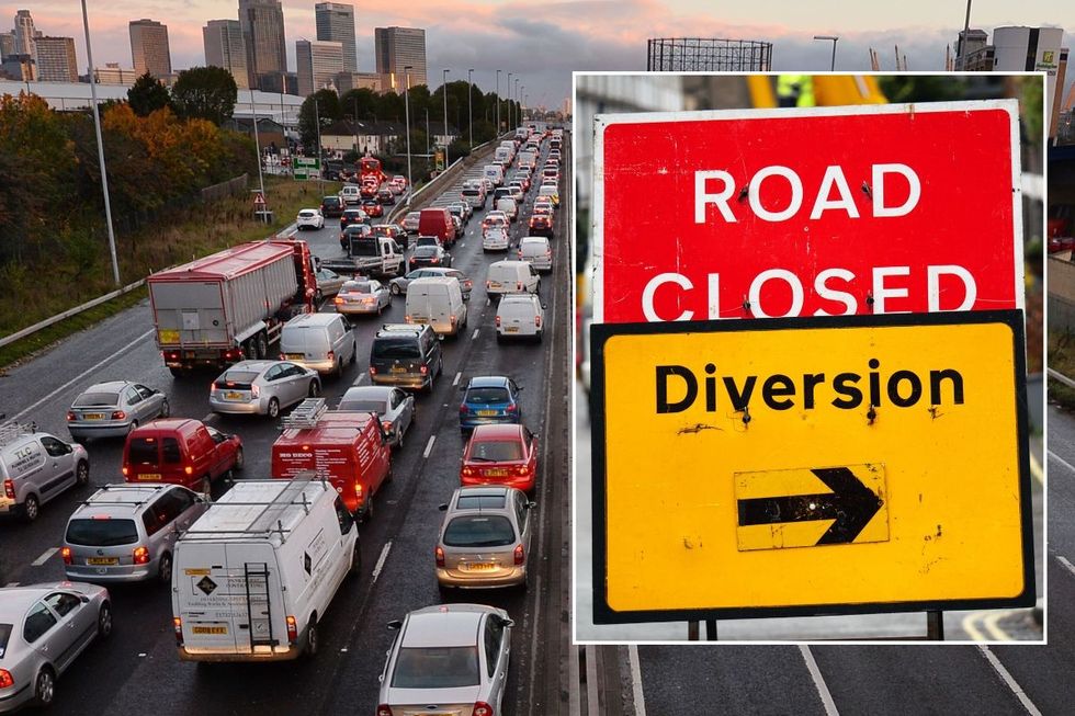Busy traffic and a road closed sign