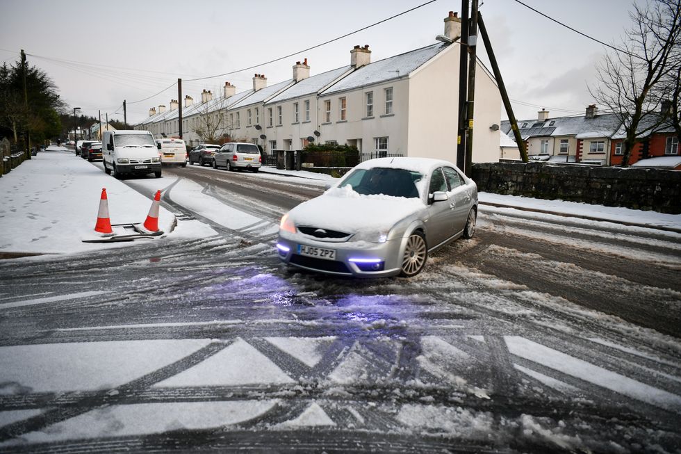 Car driving in snowy weather