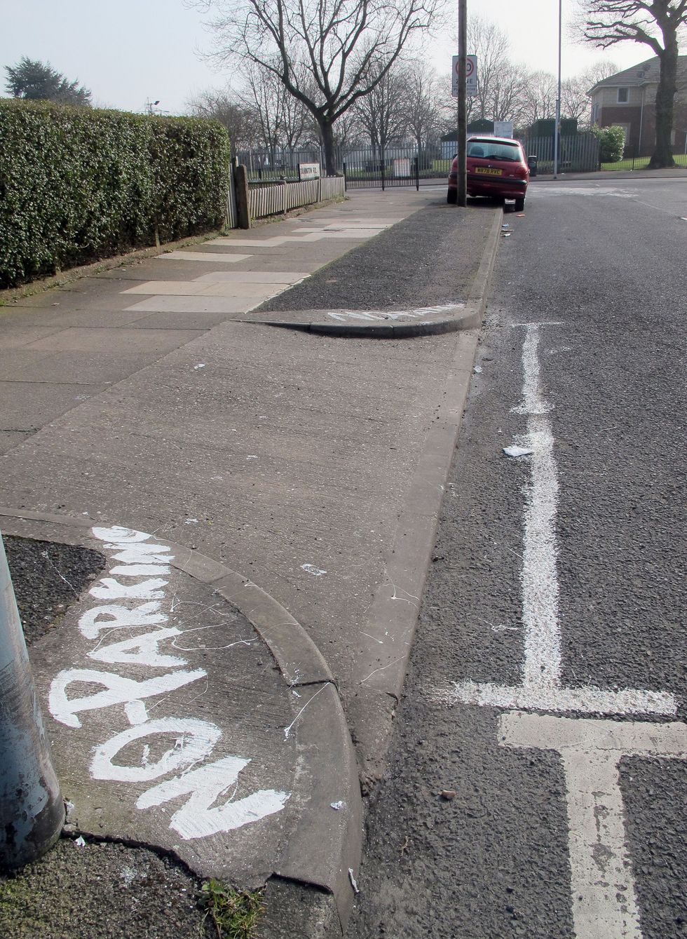 Car parked on the pavement