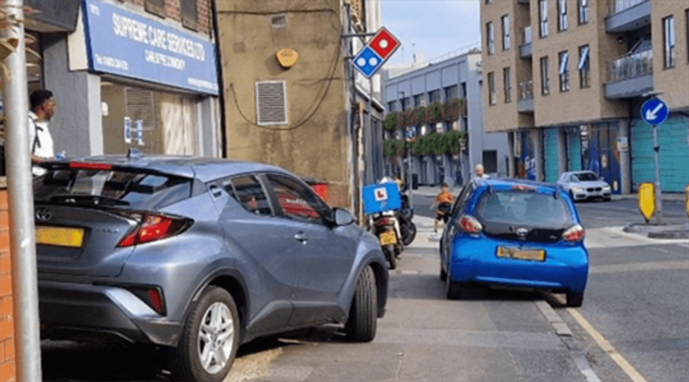 Cars parked on the pavement