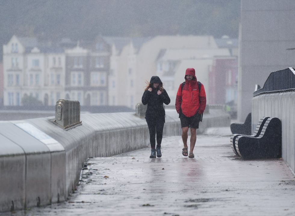 Couple caught in heavy rain in Devon