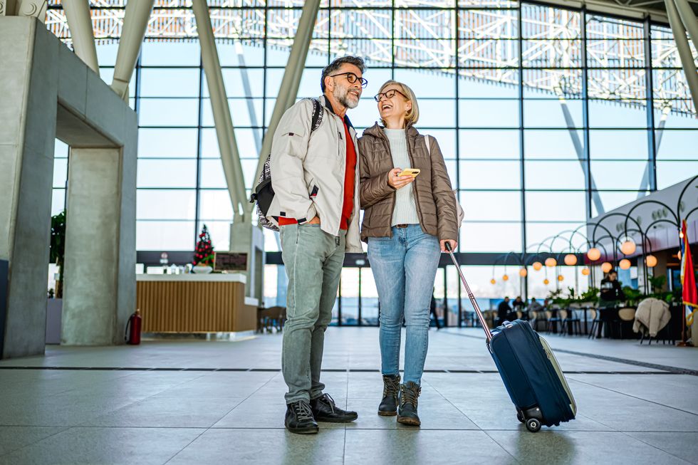 Couple smiling at airport