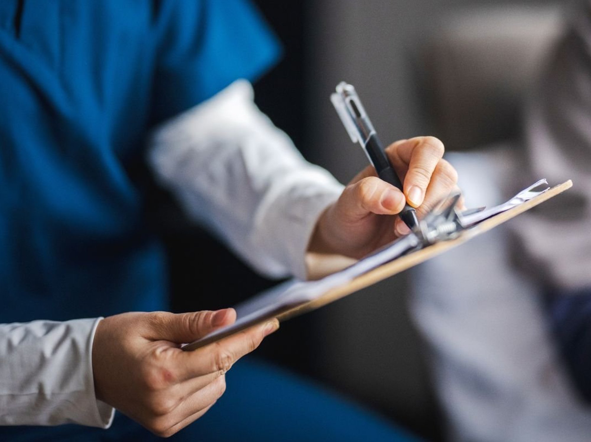 Doctor holding clipboard