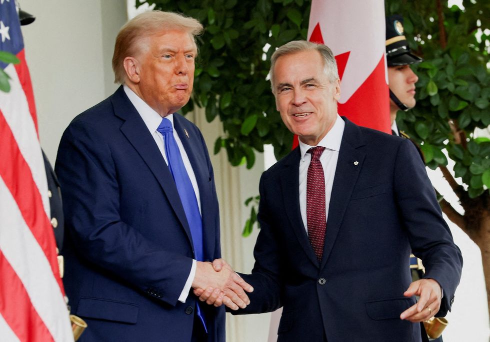 Donald Trump and Mark Carney shaking hands