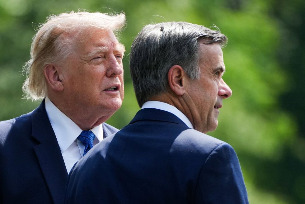 Donald Trump (left) and CIA Chief John Ratcliffe (right)