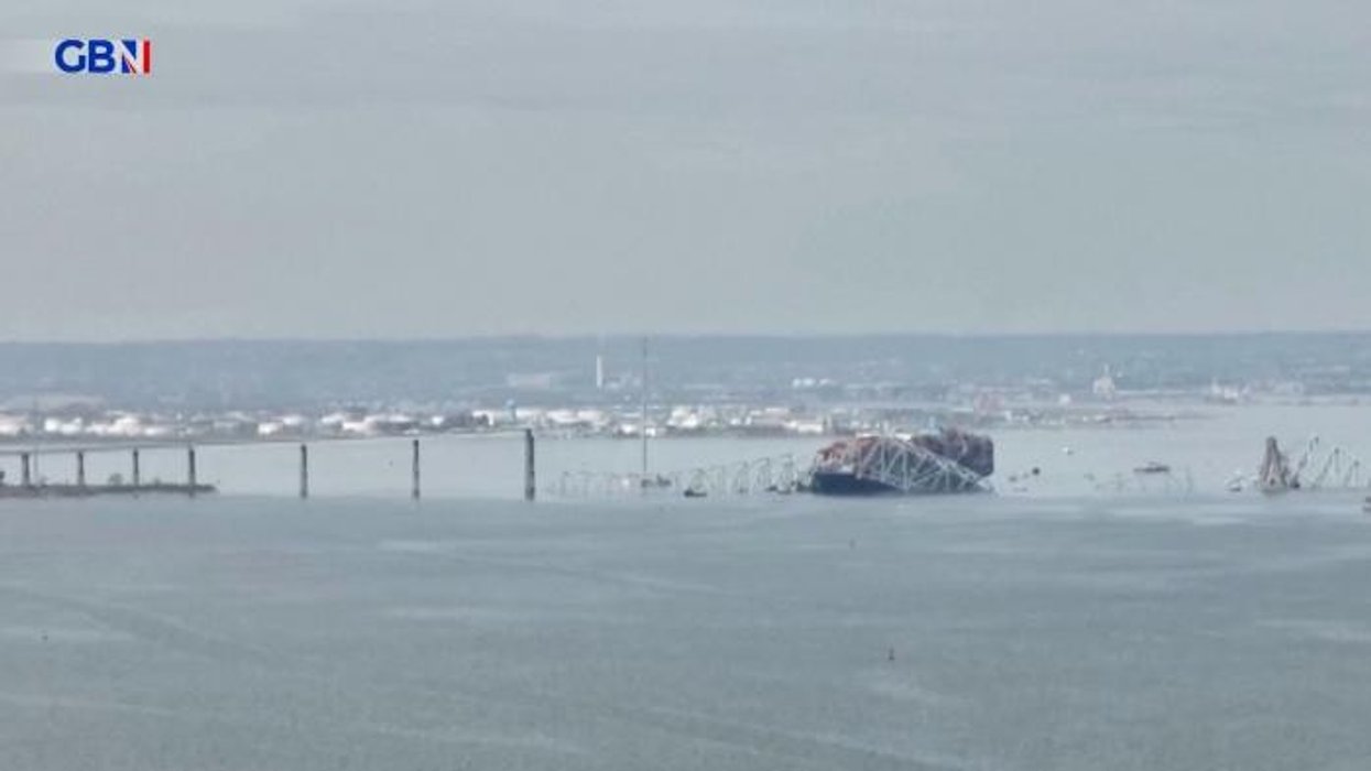 Baltimore bridge collapse: Body pulled from water amid intense search for those who fell into freezing waters