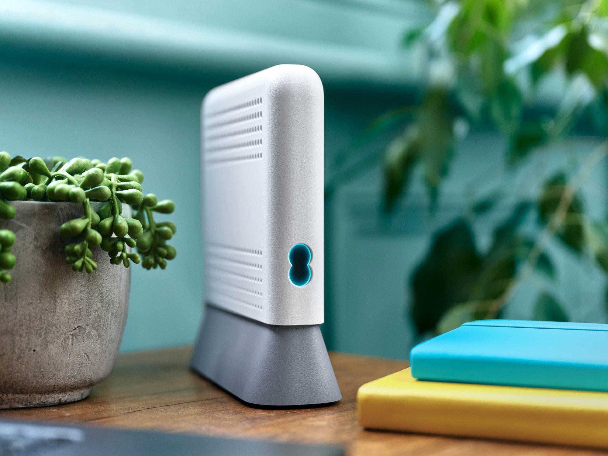 EE Wi-Fi 7 router pictured on a side table
