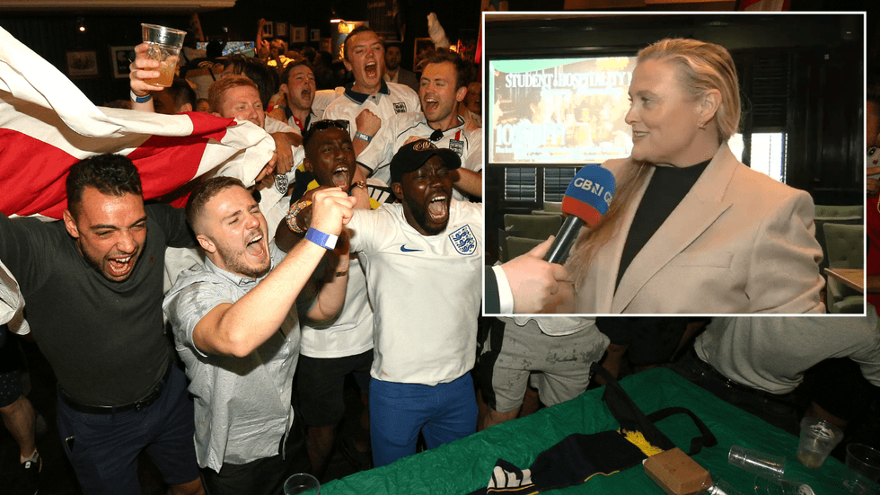 England fans celebrate a goal in a pub