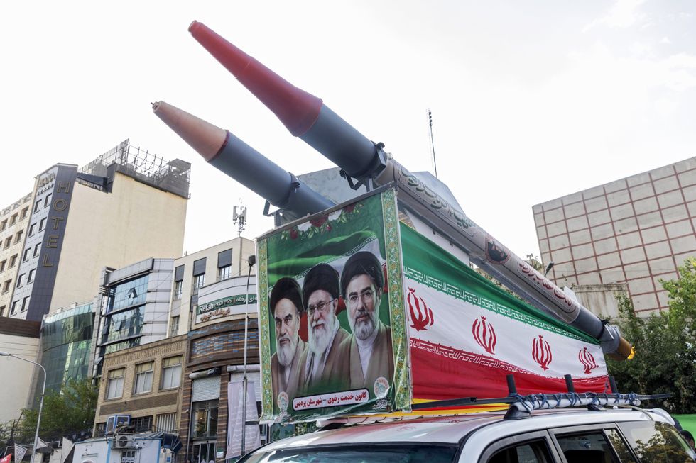 Faces of Iranian leaders branded on missiles in Tehran