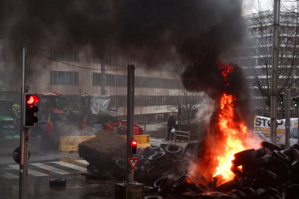 Farmers light tyres ablaze during protest
