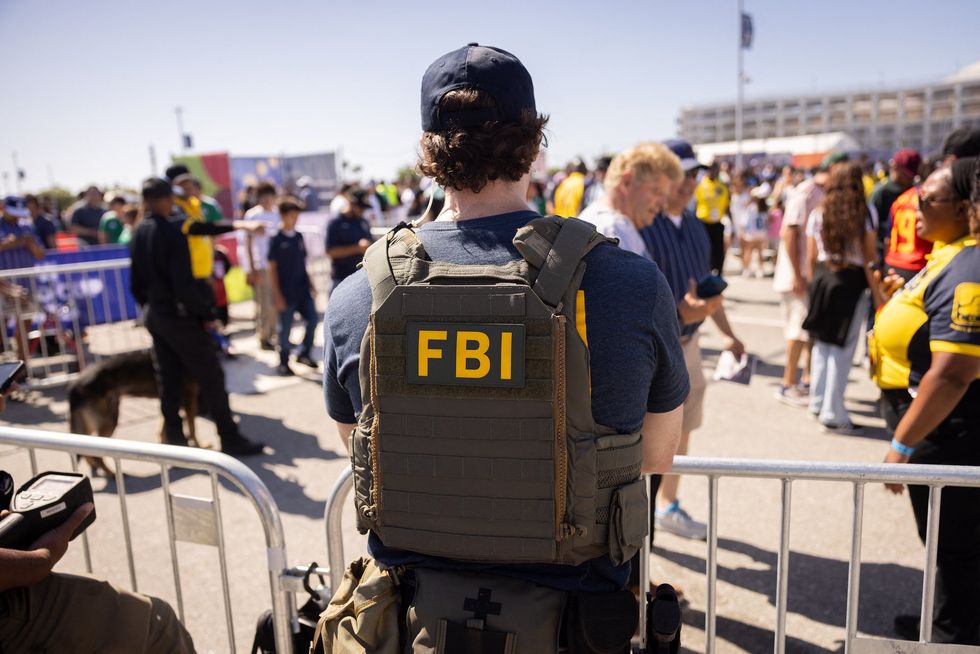 FBI officer outside Los Angeles Stadium ahead of Iran vs New Zealand football game