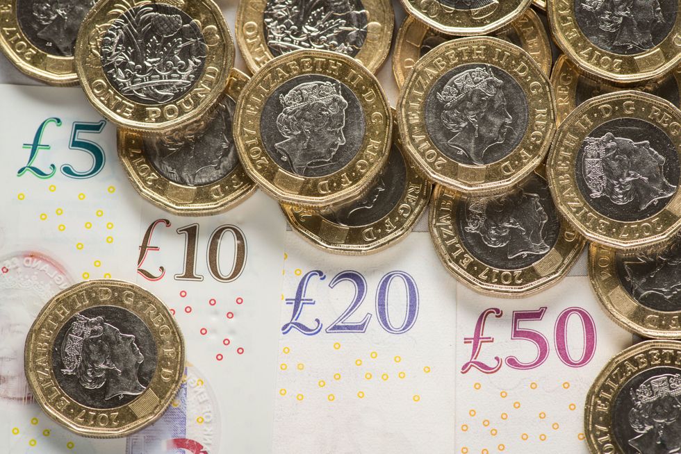 File photo dated 24/01/18 of UK five pound, ten pound, twenty pound and fifty pound notes with one pound coins. The UK economy grew by 0.5% in May, rebounding from a 0.2% drop in April, according to official figures. The Office for National Statistics (ONS) said the rise in gross domestic product (GDP) came after a bounce back across all three main sectors of the economy - services, manufacturing and construction. Issue date: Wednesday July 13, 2022.