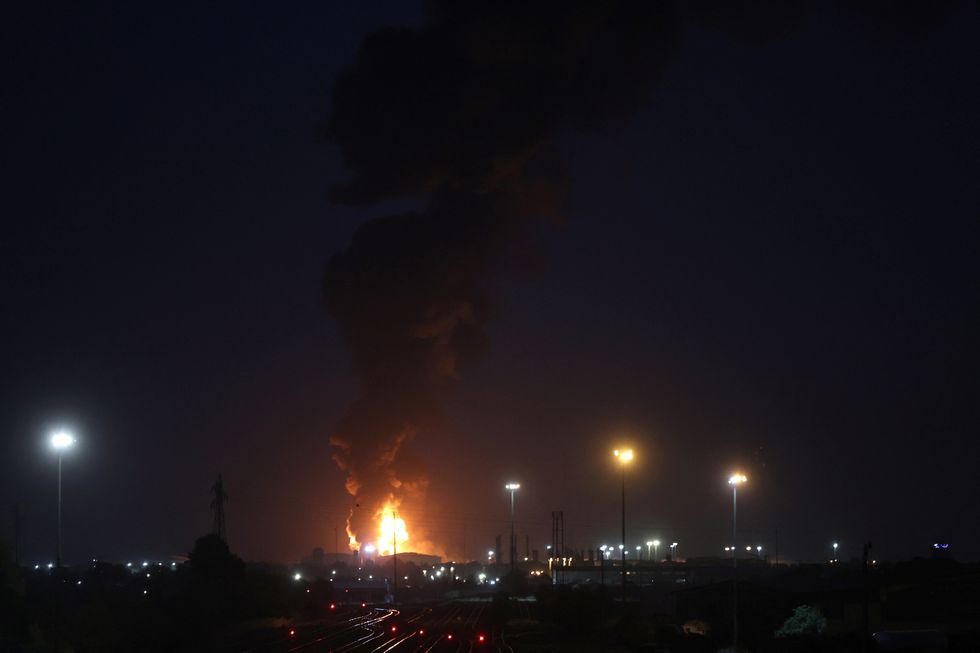 Fire is seen on Tehran Oil Refinery following Israeli strikes