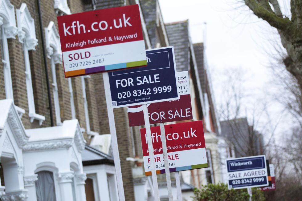 For Sale signs displayed outside houses