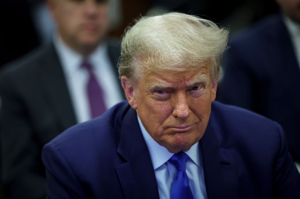 Former President Donald Trump sits in court during his civil fraud trial at New York State Supreme Court