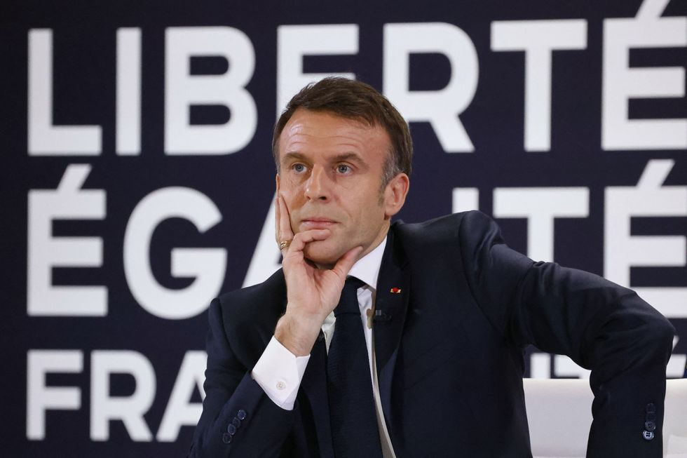 France's President Emmanuel Macron reacts during a press conference