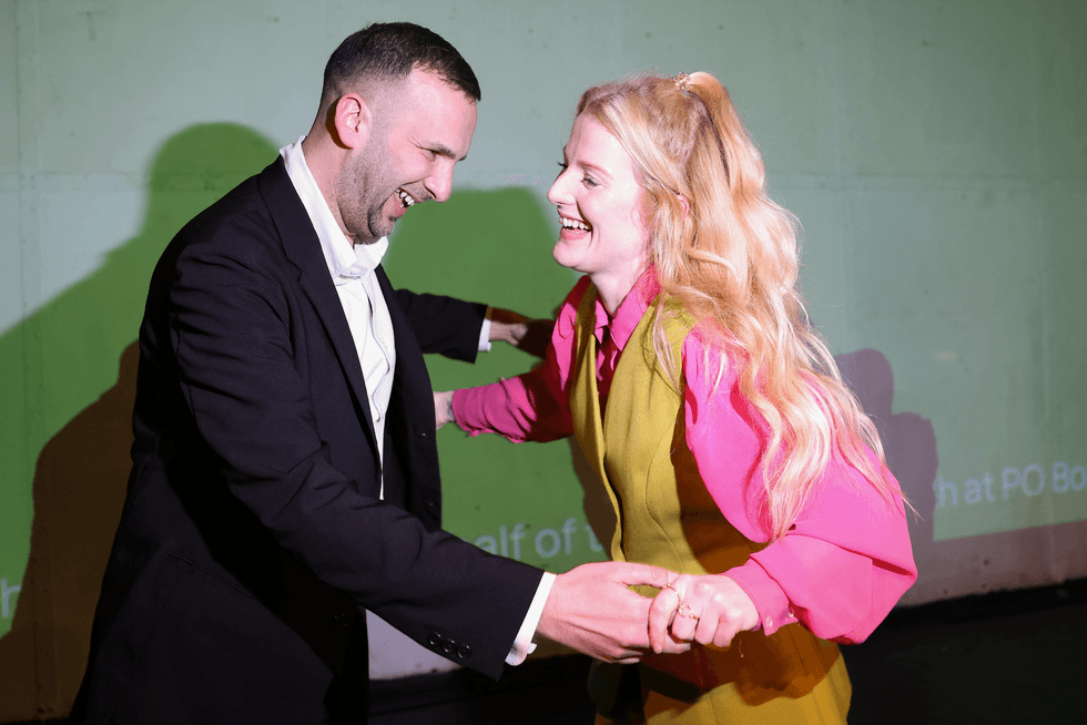 Green Party candidate and winner Hannah Spencer and Green Party leader Zack Polanski celebrate at an election rally with supporters at The Niamos Radical Arts Centre on February 26, 2026 in Manchester, England.