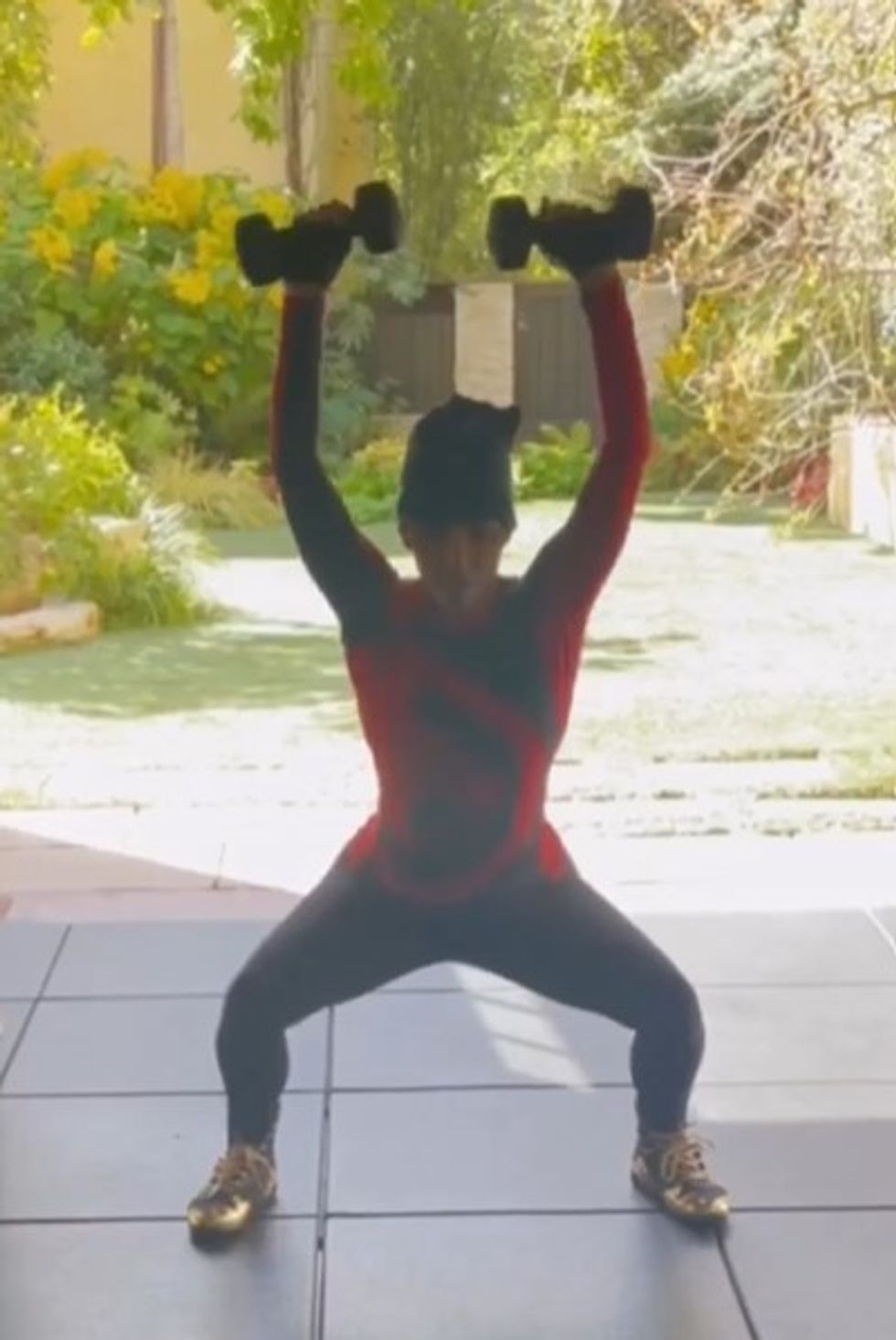 Halle Berry squatting